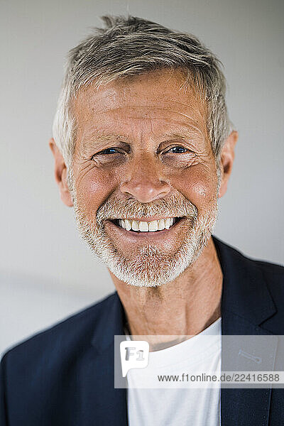 Portrait of happy senior businessman