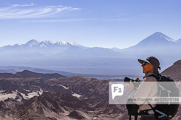 Senior male photographer looking at view in Atacama Desert