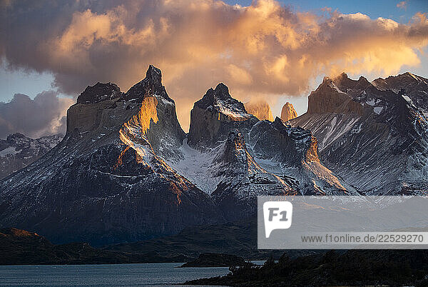 Clouds over snow covered peaks of Torres Del Paine