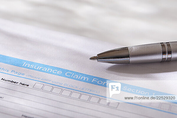 Close-up of insurance form with pen