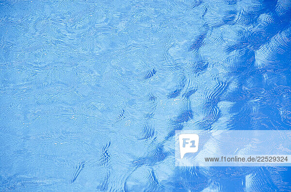 Sunlight reflected on swimming pool water