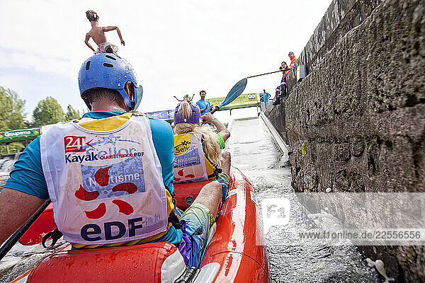 The white waters Lochrist basin hosts an annual event  the 24 hour kayaking  which on the first weekend of June  brings together 850 competitors and 10 000 spectators for a major celebration of the spirit of sport  relaxation and pleasure on the water  Inzinzac Lochrist  France.