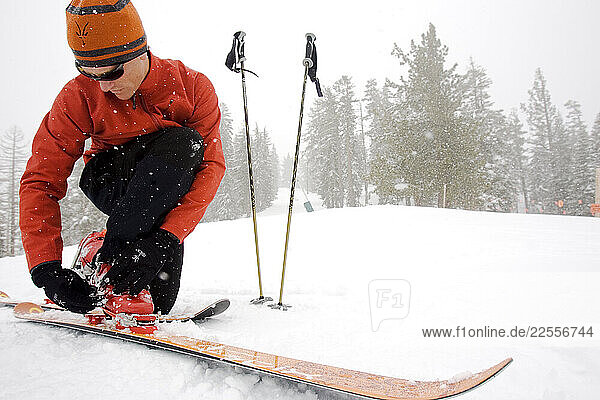 A telemark skier prepares for a ski run during a April snow storm in California s Sierra mountains.
