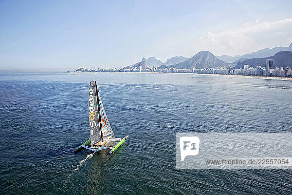 Thomas Coville and the Ultime Class 100 VPLP designed trimaran Sodebo in Rio de Janeiro  Brazil.
Thomas Coville (FRA) and his 31m maxi trimaran Sodebo Ultim’ has successfully broken the solo round the world record  completing the 28400 nm route in 49 days 3 hours 7 minutes and 38 seconds.