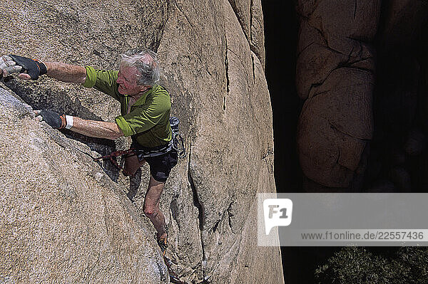 Stimson Bullitt  an octogenarian rock climber scales a difficult 5.10 crack climb in Joshua Tree National Park
