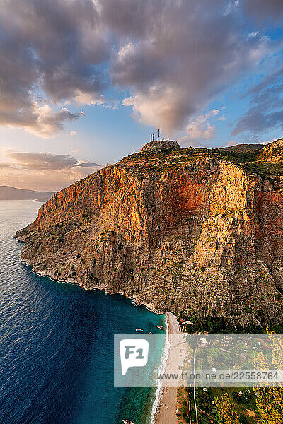 Butterfly Valley beach glowing at sunset in Fethiye