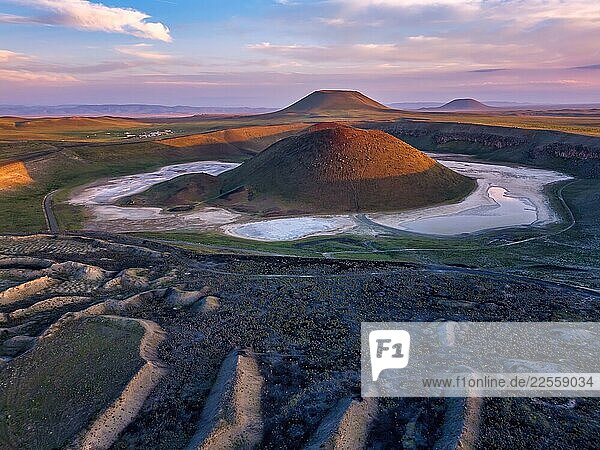 Drone aerial view of Meke Lake volcanic crater at sunset in Turkey
