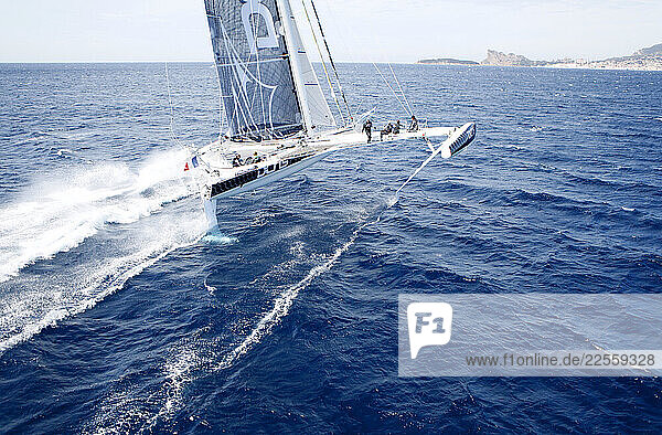 Aerial photo shoot of l Hydroptere DCNS Alain Thebault and his crew (Yves Parlier Jean le Cam Jacques Vincent Luc Alphand) during the first series of trials on the Med before