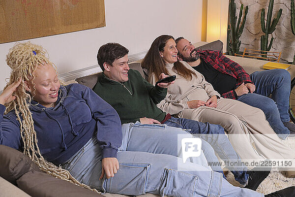 Friends watching TV at home