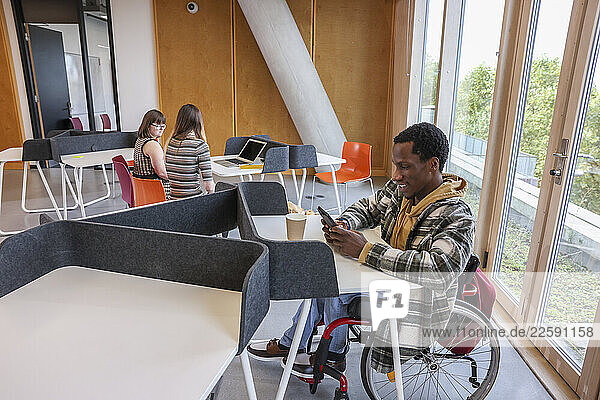 Disabled coworkers in modern office