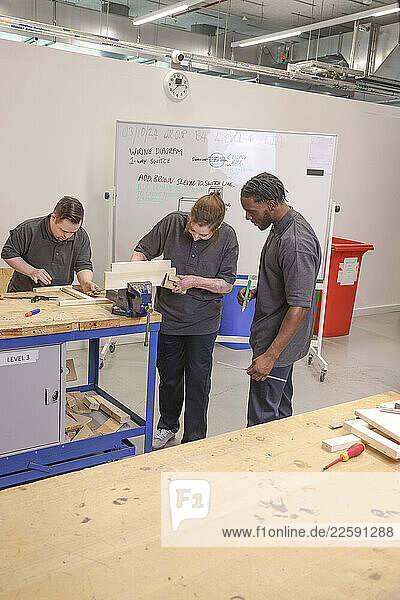 Disabled men and woman at workshop