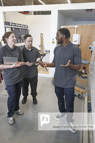 Disabled men and woman at workshop