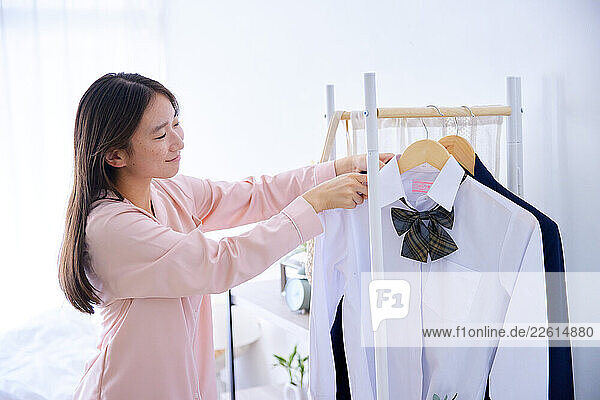 Japanese schoolgirl getting ready at home
