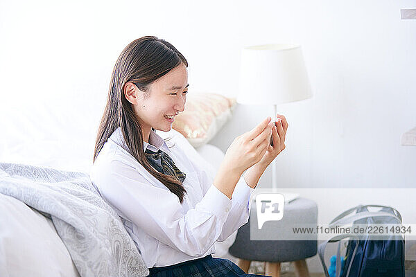Japanese schoolgirl in bed