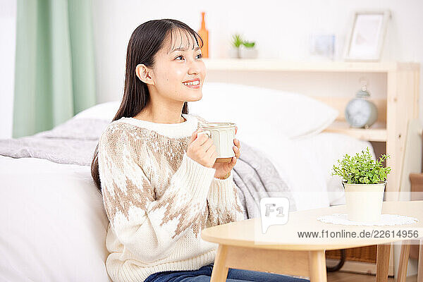Young Japanese woman at home