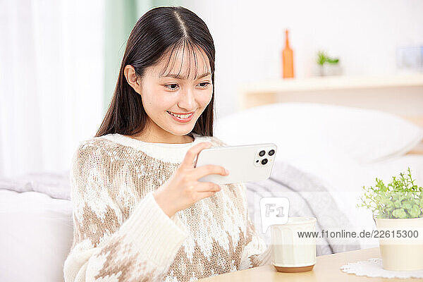 Young Japanese woman at home