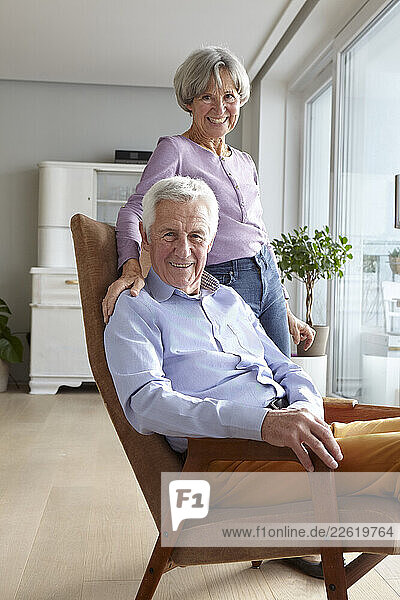 Senior couple enjoying time together at home in the living room