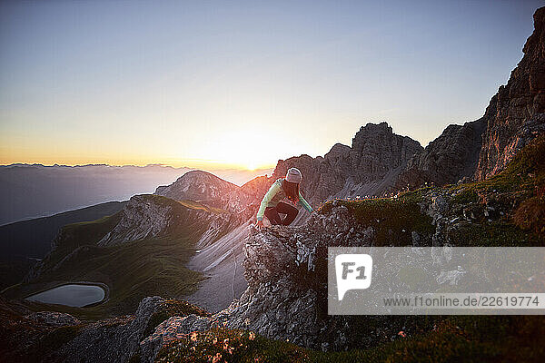 Woman climbing mountain ridge at Axamer Lizum  Austria