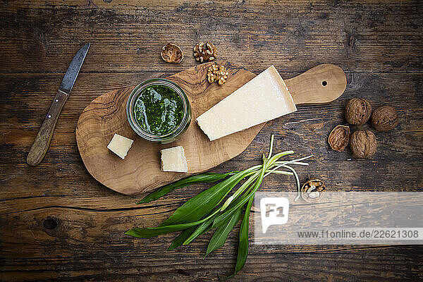 Wild garlic pesto with parmesan and walnuts on a rustic wooden table
