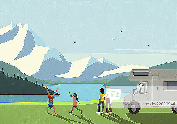 Carefree multiethnic family on vacation  standing outside camper and enjoying scenic mountain lake
