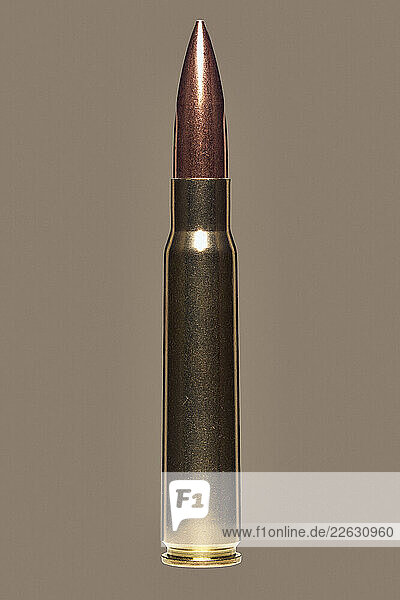 Close up studio shot 8 x 57 bullet cartridge on brown background