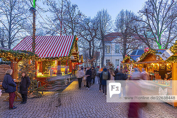View of Christmas market at Charlottenburg Palace in Schloss Charlottenburg at dusk  Berlin  Germany