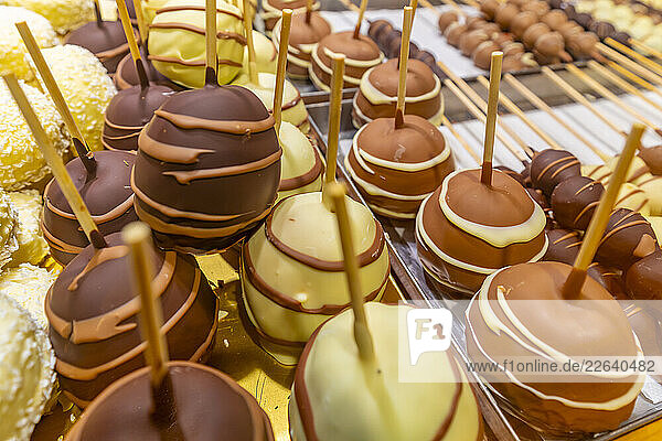 View of market stall with fruit covered in chocolate at Christmas  Breitscheidplatz  Berlin  Germany