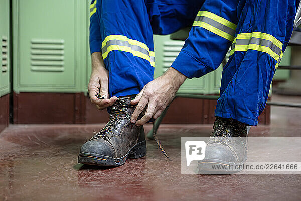 Putting on safety boots PPE
