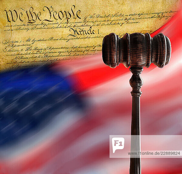 American flag flying with Declaration of Independence and gavel