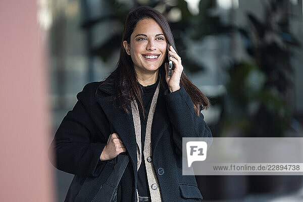 Entrepreneur woman talking on the phone outdoors