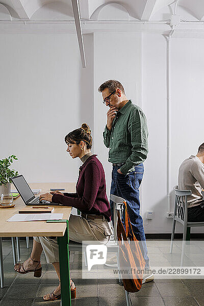 Colleagues collaborating in a modern eco-friendly office