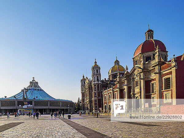New and Old Basilicas of Guadalupe and Temple and Convent of Las Capuchinas at sunset  Plaza de las Americas  Villa de Guadalupe  Mexico City  Mexico