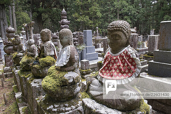 Jizo statues and graves at Okunoin of Mount Koya  a sacred Buddhist site and cemetery. Opened in 835  it houses the mausoleum of KL«kai  founder of the Shingon school of esoteric Buddhism  Wakayama Prefecture  Japan  East Asia