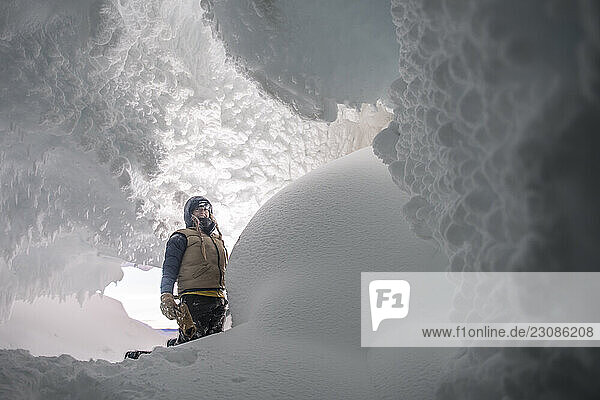 A woman in an ice cave in the Erebus Glacier on Ross Island Antarctica.