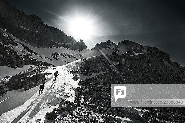 Two poeple walking over the snow to Monte Perdido in Ordesa Natural Park Huesca Spain