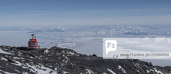 Scientists collect rock samples on the slopes of Mount Erebus Antarctica.