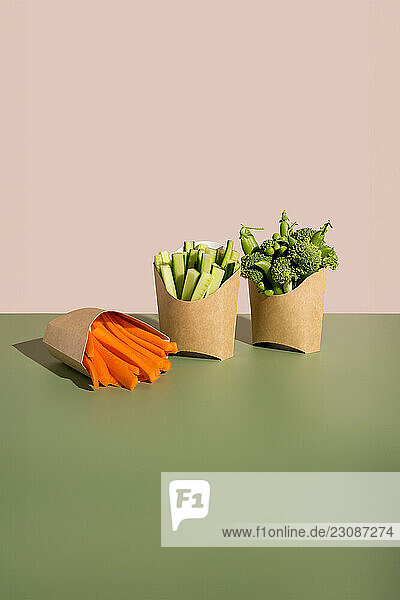 Raw vegetables snack in cardboard scoop tray healthy fast food concept