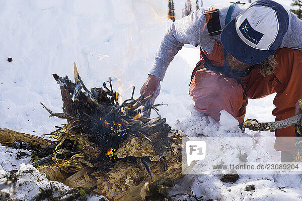 Building a fire during the winter in the backcountry